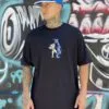 CAMISETA PLANO C. TRUMPET PRETO